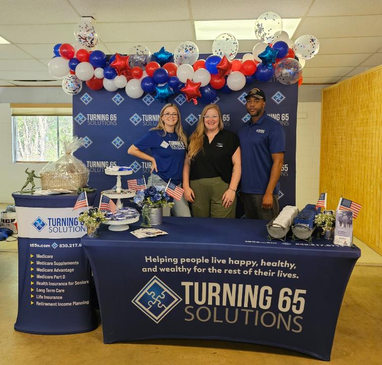 Turning 65 Solutions Desk At Local Community Event Attended By Hear in Texas