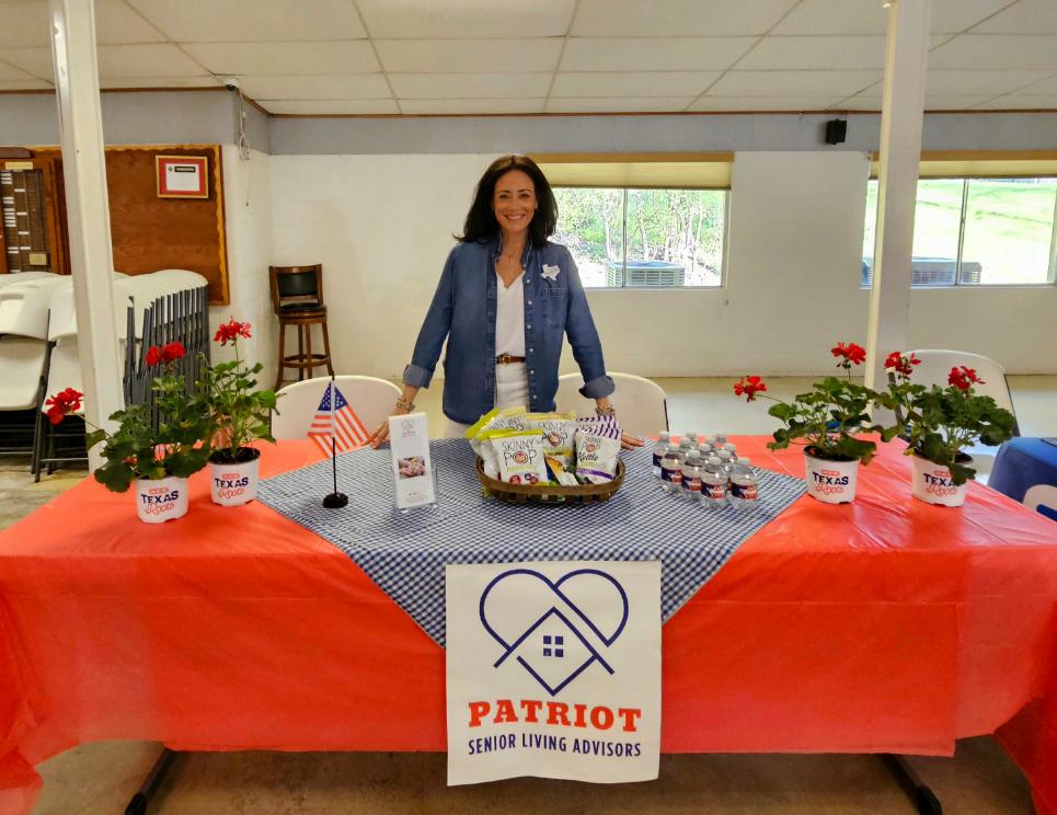 A Desk For Patriot Living Senior Advisors at Community Event Attended By Hear in Texas