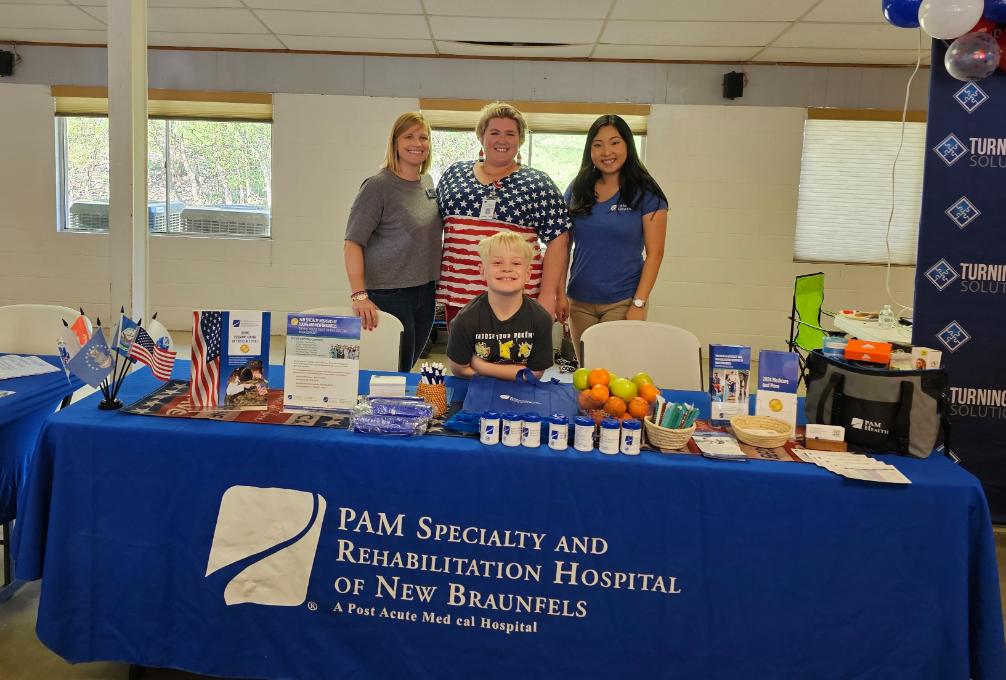 Pam Specialty and Rehabiliation Desk At Local Community Event Attended By Hear in Texas