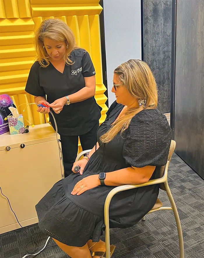 A Patient Undergoing a Physical Hearing Assessment at Hear in Texas